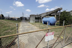 A gate at the U.S. Oil Recovery Superfund site is shown Thursday, Sept. 14, 2017, in Pasadena, Texas, where three tanks once used to store toxic waste were flooded during Hurricane Harvey. The Environmental Protection Agency says it has found no evidence that toxins washed off the site, but is still assessing damage. (AP Photo)