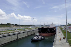A Malta flagged cargo ship named Baroque navigates the Agua Clara locks as the first test of the newly expanded Panama Canal, in Agua Clara, Panama. (Arnulfo Franco/AP Photo)