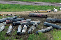 In this June 21, 2009 file photo, railroad freight cars are destroyed after a fiery explosion that killed one person are next to the train tracks following a derailment June 19 in Rockford, Ill. A new report says more and better inspections of freight railroad tracks and greater training for emergency workers are needed to address the continuing risk of fiery oil and ethanol train crashes. (AP Photo/Rockford Register Star, Scott Morgan, File)