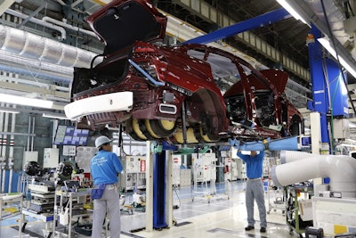 Workers of Toyota Motor Corp. assemble a Mirai fuel cell vehicle at the automaker's Motomachi plant in Toyota, western Japan. Toyota is banking on a futuristic “electrification” auto technology called hydrogen fuel cells for its zero-emissions option. The Associated Press got a tour of Toyota’s Motomachi plant that assembles the Mirai fuel cell vehicle. Toyota believes the drawbacks of batteries make electric vehicles suited more for short urban commutes, with hydrogen being the more practical energy choice of the future, in the long run. (AP Photo/Yuri Kageyama)