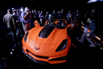 People gather around the 2019 Chevrolet Corvette ZR1 convertible after it was revealed during the AutoMobility LA auto show Tuesday, Nov. 28, 2017, in Los Angeles. (AP Photo/Chris Carlson)