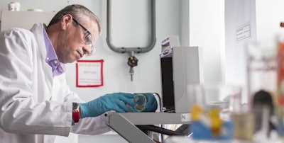 Dr Andrew Turner analyses an item of glassware using portable x-ray fluorescence (XRF) spectrometry. (Lloyd Russell/University of Plymouth)