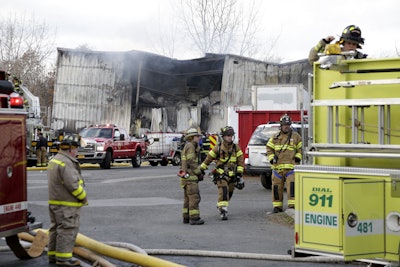 Firefighters work at the scene of a factory fire in New Windsor, N.Y., Monday, Nov. 20, 2017. Authorities say two explosions and a fire at the Verla International cosmetics factory in the Hudson Valley about an hour north of New York City have left multiple people injured, including firefighters caught in the second blast. (AP Photo/Seth Wenig)