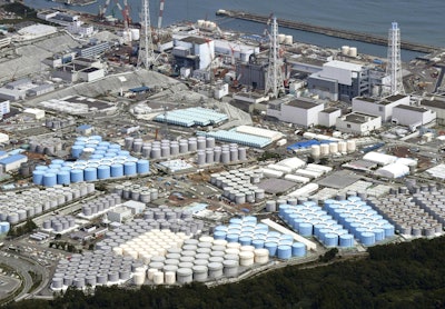 In this Sept. 2017, photo, tanks are seen at Fukushima Dai-ichi nuclear plant in Okuma. More than six years after a tsunami overwhelmed the Fukushima nuclear power plant, Japan has yet to reach consensus on what to do with a million tons of radioactive water, stored on site in around 900 large and densely packed tanks that could spill should another major earthquake or tsunami strike. (Daisuke Suzuki/Kyodo News via AP)