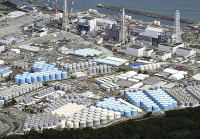 In this Sept. 2017, photo, tanks are seen at Fukushima Dai-ichi nuclear plant in Okuma. More than six years after a tsunami overwhelmed the Fukushima nuclear power plant, Japan has yet to reach consensus on what to do with a million tons of radioactive water, stored on site in around 900 large and densely packed tanks that could spill should another major earthquake or tsunami strike. (Daisuke Suzuki/Kyodo News via AP)