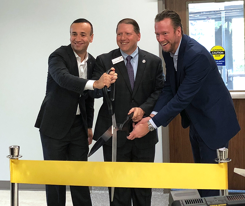 (left to right) HARTING Americas president and CEO Jon DeSouza, North Central President Troy D. Hammond and HARTING chairman of the board Philip Harting cut the ribbon to the HARTING Electronics Lab.