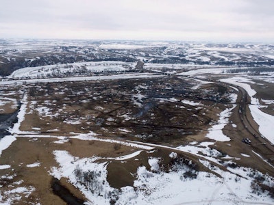 This Feb. 13, 2017, aerial file photo shows a site where the final phase of the Dakota Access Pipeline near the Missouri River took place with boring equipment routing the pipeline underground and across Lake Oahe to connect with the existing pipeline in Emmons County in Cannon Ball, N.D. (Tom Stromme/The Bismarck Tribune via AP, File)
