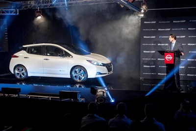 Jose Munoz, the chairman of Nissan North America, presents the first 2018 Nissan Leaf produced at the Japanese automaker's sprawling plant in Smyrna, Tenn., Monday, Dec. 4, 2017. (AP Photo/Erik Schelzig)