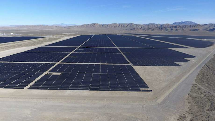 Solar arrays line the desert floor of the Dry Lake Solar Energy Zone as part of the 179 megawatt (MW) Switch Station 1 and Switch Station 2 Solar Projects north of Las Vegas that were commissioned on Monday, Dec. 11, 2017. (Michael Quine/Las Vegas Review-Journal via AP)