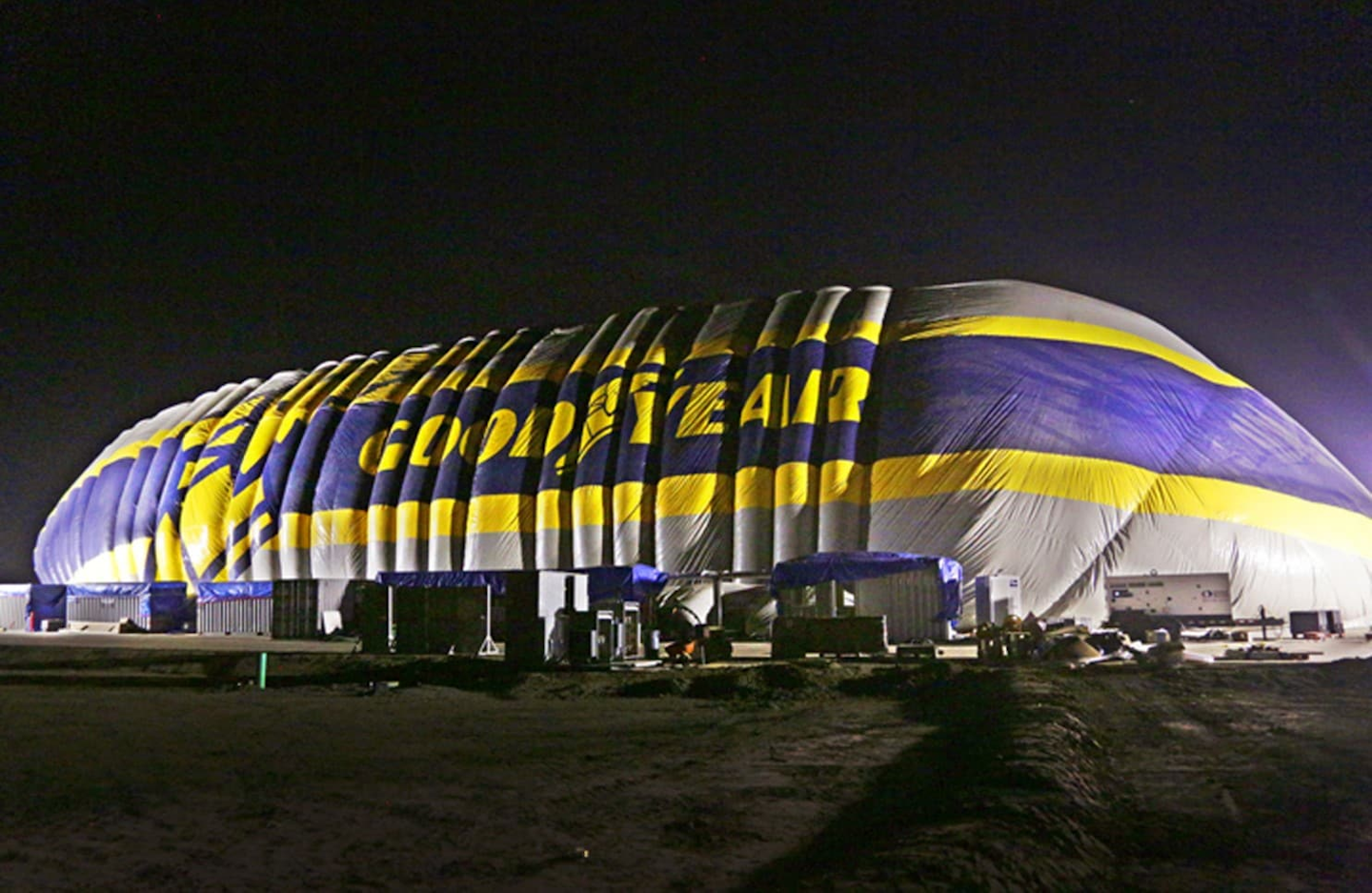 This photo provided by the Goodyear Tire & Rubber Co. shows the nearly-complete inflation of a giant inflatable hangar that will be the permanent home of one of the company's new semi-rigid airships, Wednesday, Dec. 13, 2017 in Carson, Calif. The building standing nine stories tall and stretching the length of a football field went up early Wednesday along Interstate 405 south of Los Angeles. (Goodyear Tire & Rubber Co. via AP)