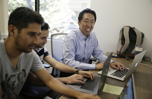 Computer scientist Andrew Ng, right, works with others at his office in Palo Alto, Calif. Ng, one of the leading figures in AI, is launching a startup called Landing.AI. Its aim initially is to help manufacturing companies use computer algorithms to cut costs, improve quality control, remove supply-chain bottlenecks, and more. (AP Photo/Eric Risberg, File)