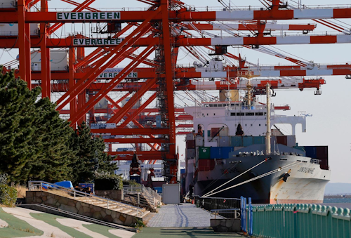 In this Dec. 14, 2017, photo, a cargo ship waits to be loaded at a port in Tokyo. Japan reported Monday, Dec. 18, 2017 its exports rose 16 percent in November from a year earlier while imports jumped 17 percent. Customs data released Monday showed the trade surplus slipping to 113.4 billion yen ($1 billion) on exports of 6.92 trillion yen ($61.4 billion). Imports totaled 6.81 trillion yen ($60.4 billion). (AP Photo/Shizuo Kambayashi)