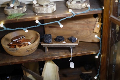 Lumps of coal are sold as ornamental trinkets at the Winding Road Marketplace, a hub for selling the wares of local businesses, stands in his store, Thursday, Dec. 14, 2017, in Shawnee, Ohio. Communities across Appalachia are turning increasingly to the region's rich reserves in things other than coal, namely, history and rugged natural beauty, to frame a new tourist economy. Enjoying a drink, hike or overnight stay or in region infused with stories, sweat and strife is turning out to be a draw to aging baby boomers and millennials alike. Studies show these efforts are attracting tourists, new residents and a new sense of self-worth. (AP Photo/John Minchillo)