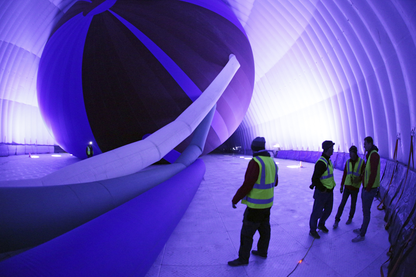 This photo provided by the Goodyear Tire & Rubber Co. shows a stage of the inflation of a giant inflatable hangar that will be the permanent home of one of the company's new semi-rigid airships, Wednesday, Dec. 13, 2017 in Carson, Calif. The building standing nine stories tall and stretching the length of a football field went up early Wednesday along Interstate 405 south of Los Angeles. (Goodyear Tire & Rubber Co. via AP)
