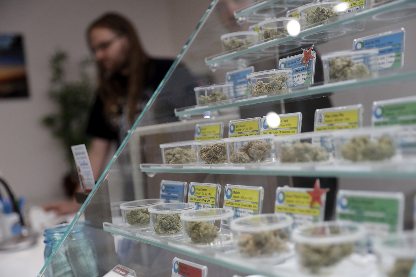 In this Dec. 29, 2017, photo, various kinds of marijuana strains are displayed at the KindPeoples dispensary in Santa Cruz, Calif. Californians may awake on New Year's Day to a stronger-than-normal whiff of marijuana as America's cannabis king lights up to celebrate the state's first legal retail pot sales. (AP Photo/Marcio Jose Sanchez)