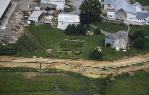 In this July 5, 2017, file photo, pipes for the Sunoco Mariner East pipeline are placed in South Lebanon Township, Pa. The Pennsylvania Department of Environmental Protection announced Wednesday, Jan. 3, 2018, it has ordered Sunoco to halt construction of the Mariner East 2 natural gas pipeline across the southern part of the state, citing a series of spills and other 'egregious and willful violations' of state law. (Jeremy Long/Lebanon Daily News via AP, File)