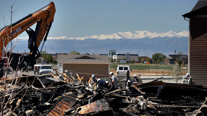 In this May 4, 2017, file photo, workers dismantle the charred remains of a house where an explosion killed two people in Firestone, Colo. Energy companies, local governments and advocacy groups will debate proposed new rules for oil and gas pipelines in Colorado after the fatal explosion last year blamed on leaking gas. The Colorado Oil and Gas Conservation Commission opens two days of hearings Monday, Jan. 8, 2018, on regulations for installing, testing and shutting down lines that carry oil and gas from wells to equipment. (AP Photo/Brennan Linsley, File)