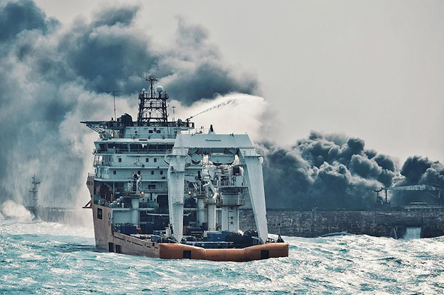 In this Jan. 10, 2018 photo provided by China's Ministry of Transport, a firefighting boat works to put on a blaze on the oil tanker Sanchi in the East China Sea off the eastern coast of China. Rescue ships looking for missing crew members from the oil tanker Sanchi have expanded their search area to more than 2,600 square kilometers (1,000 square miles) as Chinese state television reported Friday that maritime authorities still have not found any survivors, or put out the blaze onboard the ship. (China's Ministry of Transport via AP)