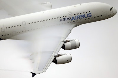 Vapor forms across the wings of an Airbus A380 as it performs a demonstration flight at the Paris Air Show, Le Bourget airport, north of Paris. Emirates airline said in a statement Thursday, Jan. 18, 2018, that they are purchasing 20 A380 aircraft with the option for 16 more in a deal worth $16 billion, throwing a lifeline to the European-made double-decker jumbo jets. (AP Photo/Francois Mori, File)