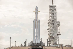This Dec. 28, 2017 photo made available by SpaceX shows a Falcon Heavy rocket at Cape Canaveral, Fla. On Wednesday, Jan. 24, 2018, the rocket's three boosters — 27 engines in all — were tested. SpaceX is aiming for a February launch. (SpaceX via AP)