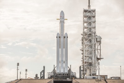 This Dec. 28, 2017 photo made available by SpaceX shows a Falcon Heavy rocket at Cape Canaveral, Fla. On Wednesday, Jan. 24, 2018, the rocket's three boosters — 27 engines in all — were tested. SpaceX is aiming for a February launch. (SpaceX via AP)
