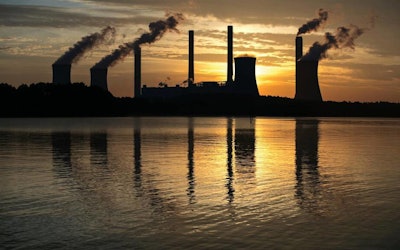 The coal-fired Plant Scherer in Juliette, Ga. The Trump administration is doing away with a decades-old air emissions policy opposed by fossil fuel companies, a move that environmental groups say will result in more pollution. The Environmental Protection Agency issued notice Thursday it is withdrawing the “once-in always-in” policy under the Clean Air Act, which dictated how major sources of hazardous air pollutants are regulated. (AP Photo/Branden Camp, File)