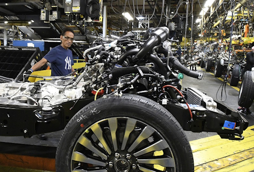 In this Oct. 27, 2017, photo, workers assembling Ford trucks at the Ford Kentucky Truck Plant in Louisville, Ky. On Thursday, Feb. 15, 2018, the Federal Reserve reports on U.S. industrial production for January. Image credit: AP Photo/Timothy D. Easley