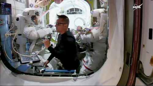 From left, astronauts Norishige Kanai, Joe Acaba, and Mark Vande on the International Space Station. Kanai and Vande recovered aging equipment from the Canadarm gripper on the morning of Feb. 16.