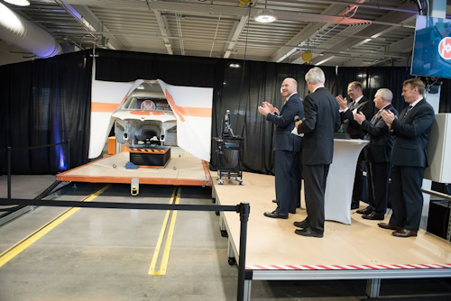 Clemson President James P. Clements observes a vehicle body on the prototype assembly line at the Vehicle Assembly Center. Image credit: Clemson University Relations