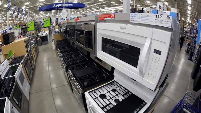 This Jan. 22, 2018, file photo shows a Whirlpool microwave and oven on display in the appliance section of a Lowe's in Wexford, Pa. Image credit: AP Photo/Gene J. Puskar, File