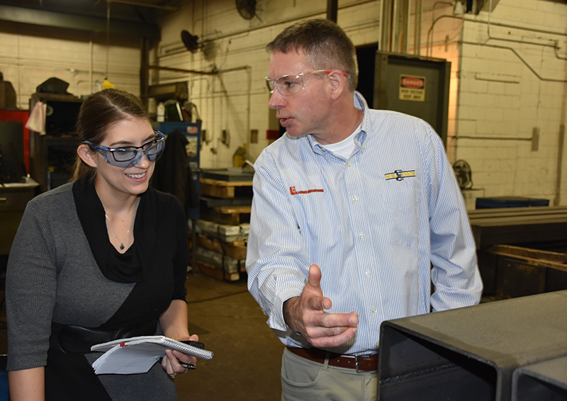 Wildeck director of sales, Paul Mihelich, discusses how all products are made to order at the Wisconsin facility with IMPO editor Rachelle Blair-Frasier. (Wildeck photo)