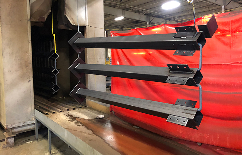 Before final assembly, parts make their way through the paint line at Wildeck. (IMPO photo)
