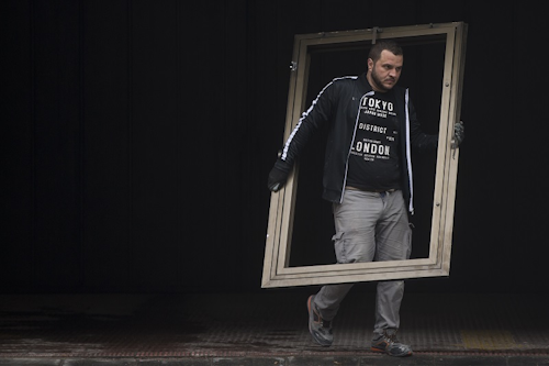 A worker carries an old window frame from a construction site in Madrid, Spain, Wednesday, Feb. 28, 2018. Image credit: AP Photo/Paul White