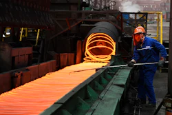 vIn this March 5, 2018 photo, a worker manipulates coils of steel at Xiwang Special Steel in Zouping County in eastern China's Shandong province. Image credit: Chinatopix via AP