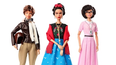 This product image released by Barbie shows dolls in the image of pilot Amelia Earhart, left, Mexican artist Frida Kahlo and mathematician Katherine Johnson, part of the Inspiring Women doll line series being launched ahead of International Women’s Day. Image credit: Barbie via AP