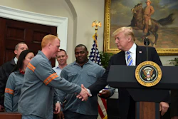 President Donald Trump reaches out to shake the hand of Dusty Stevens, a superintendent at Century Aluminum Potline, during an event in the Roosevelt Room of the White House in Washington, Thursday, March 8, 2018. Image credit: AP Photo/Susan Walsh