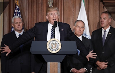 In this March 28, 2017 file photo, President Donald Trump, accompanied by from left, Vice President Mike Pence, Environmental Protection Agency (EPA) Administrator Scott Pruitt, and Interior Secretary Ryan Zinke, speaks at EPA headquarters in Washington, prior to signing an Energy Independence Executive Order.