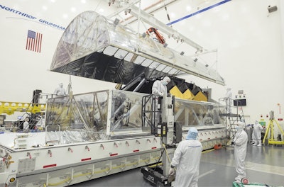 Engineers open the interior tent frame of the Space Telescope Transporter for Air, Road and Sea (STTARS) at Northrop Grumman in Redondo Beach, California, on March 8, 2018, to reveal its precious cargo — the combined optics and science instruments of NASA’s James Webb Space Telescope. Image credit: NASA/Chris Gunn