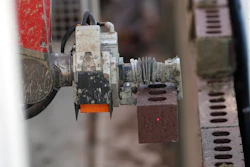 In this Tuesday, Feb. 27, 2018, photo, Samantha, a robotic bricklayer, is shown at work on the facade of a school in the south Denver suburb of Englewood, Colo. Image credit: AP Photo/David ZalubowskiAP Photo/David Zalubowski