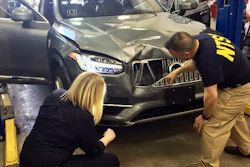In this March 20, 2018, photo provided by the National Transportation Safety Board, investigators examine a driverless Uber SUV that fatally struck a woman in Tempe, Ariz. Image credit: National Transportation Safety Board via AP