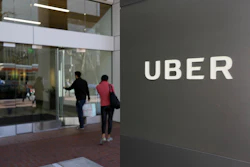 In this March 1, 2017 file photo, people enter the headquarters of Uber in San Francisco. Uber suspended all of its self-driving testing Monday, March 19, 2018, after what is believed to be the first fatal pedestrian crash involving the vehicles. Image credit: AP Photo/Eric Risberg, File
