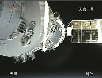 In this Nov. 3, 2011, file image taken from video from China's CCTV via AP Video, China's Shenzhou-8 spacecraft is docked with the orbiting Tiangong-1 space station. Image credit: CCTV via AP Video, File