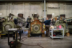 Norfolk Southern locomotives, one refurbished and one awaiting refurbishment, sit side-by-side at the Fort Worth GE factory. Image credit: GE Transportation