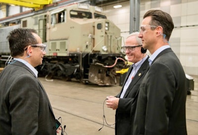 From left, Sameer Gaur, general manager for GE Transportation's global parts business and product management, speaks with Norfolk Southern Assistant Vice President of Mechanical Doug Corbyn and GE Transportation Vice President Pascal Schweitzer. Image credit: GE Transportation