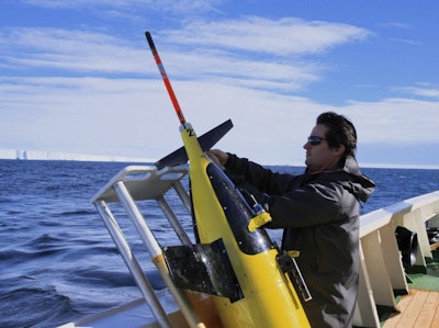 Dr. Pierre Dutrieux of Columbia University works on one of the Seagliders. Image credit: Paul Allen Philanthropies