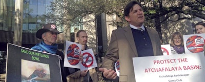 In a Thursday, Feb. 8, 2018 file photo, Scott Eustis, a community science director for the Gulf Restoration Network, speaks before a hearing in federal court in New Orleans, LA. A consortium of environmental groups sued the U.S. Army Corps of Engineers to halt construction of a pipeline through a river swamp in South Louisiana. A federal appeals court has scheduled a hearing for Tuesday, March 13, 2018, to review a judge’s order that halted construction of a crude oil pipeline in a Louisiana swamp. Bayou Bridge Pipeline LLC asked the 5th U.S. Circuit Court of Appeals for an “emergency stay” that would lift the suspension of construction work while it appeals the judge’s ruling. (AP Photo/Michael Kunzelman, File)