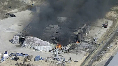 In this image from video by KDFW, a fire burns at the Tri-Chem Industries plan in Cresson, Texas. Officials said fears of another blast amid the toxic chemicals prevented crews from battling the blaze. (KDFW via AP)