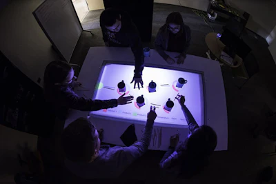 Students simulate reactions in a chemical plant using an augmented reality tabletop developed in the lab of Andrew White, assistant professor of chemical engineering, at the University of Rochester. (University of Rochester photo/J. Adam Fenster)