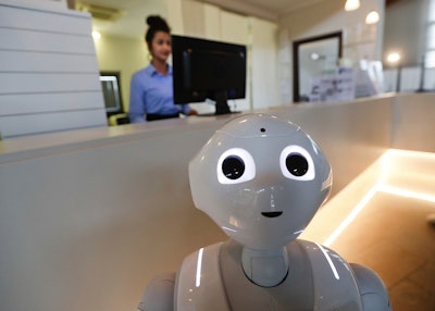 In this photo dated March 12, 2018, robot Robby Pepper stands at the front desk of hotel in Peschiera del Garda, northern Italy, Monday, March 12, 2018.Image credit: AP Photo/Luca Bruno