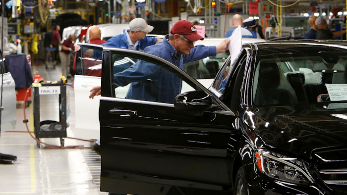 In this Feb. 14, 2017, file photo, employees do assembly and quality control work on automobiles at the Mercedes-Benz plant in Tuscaloosa, Ala. Image credit: Gary Cosby Jr./The Tuscaloosa News via AP, File
